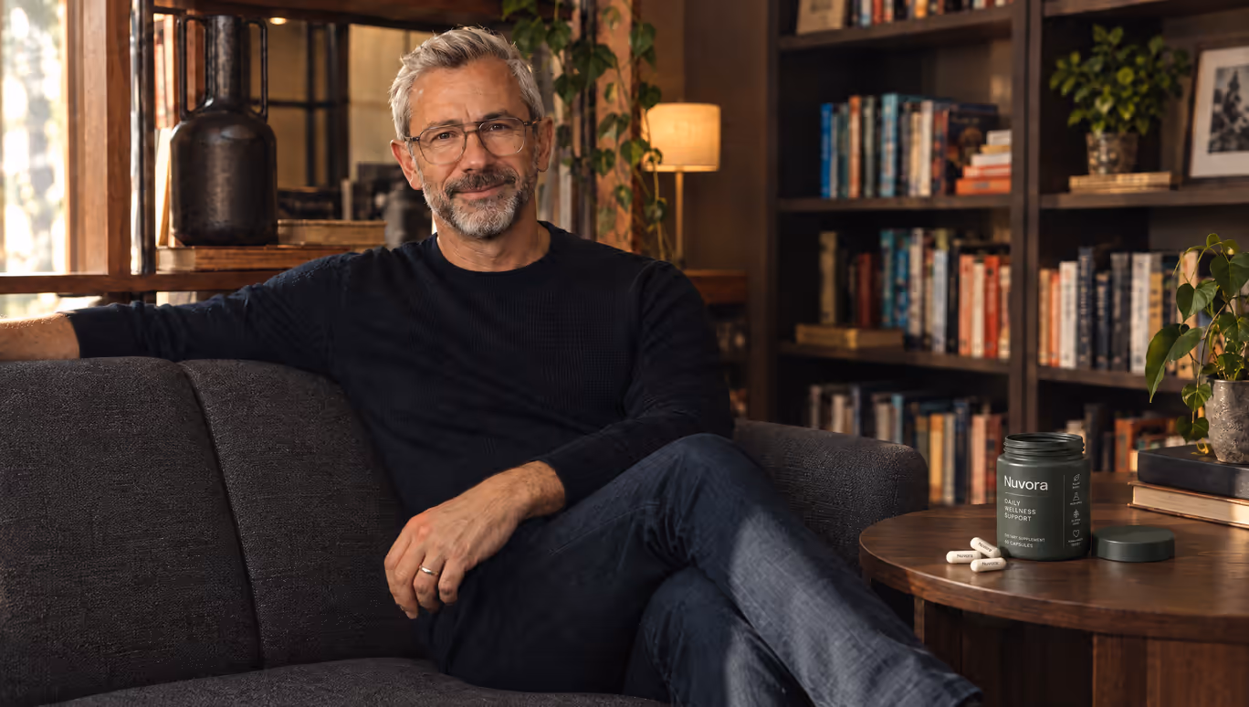 Evan Brooks on the sofa in his study, a jar of Nuvora on the side table